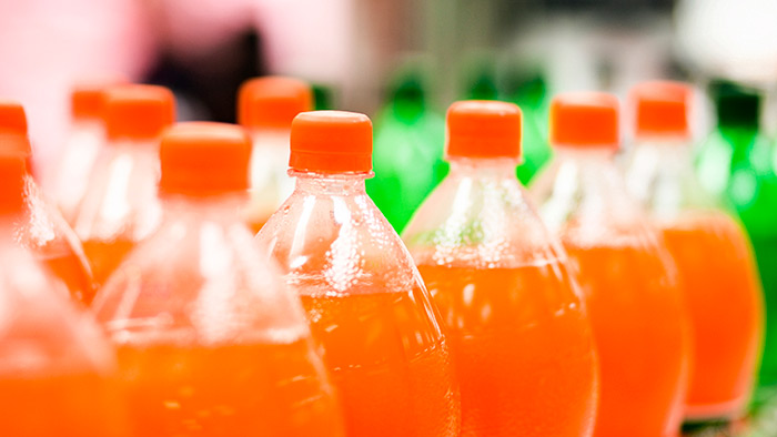 Rows of soda bottles in a line