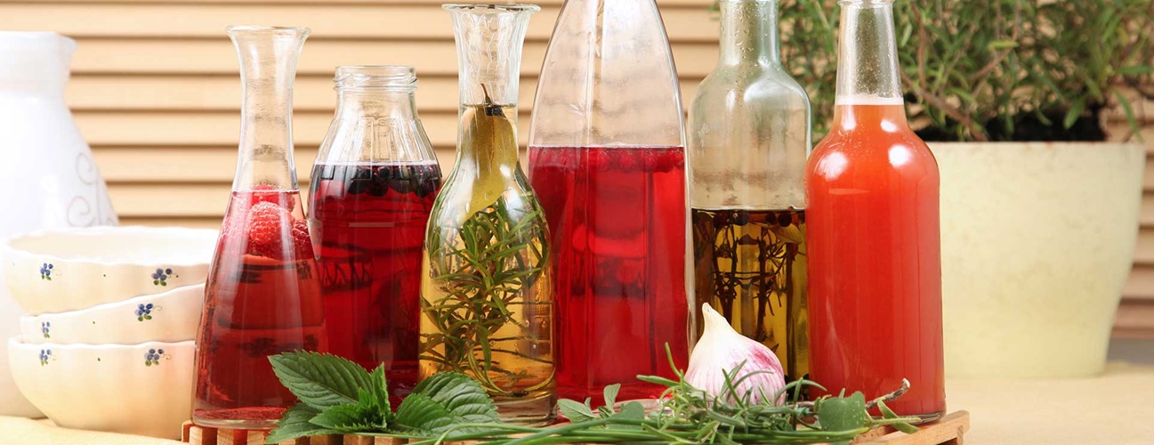 Decorative bottles of vinegar and oil.