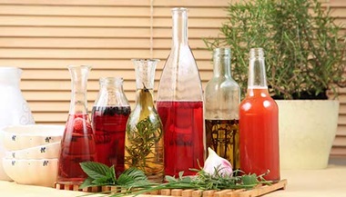Decorative bottles of vinegar and oil.