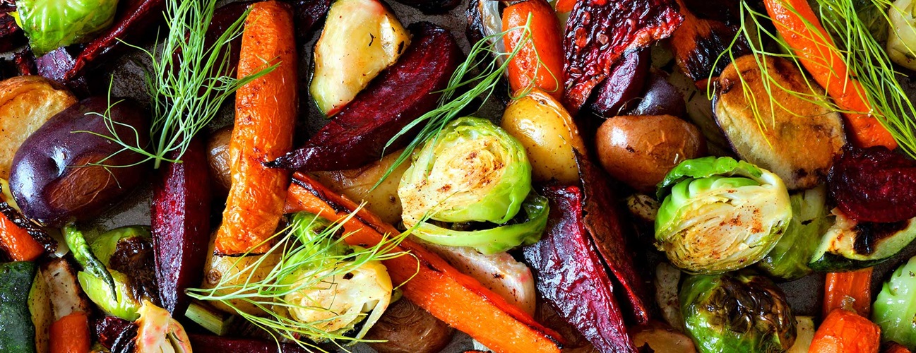 A colorful close up of roasted vegetables.