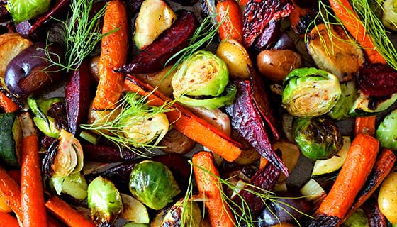 A colorful close up of roasted vegetables.