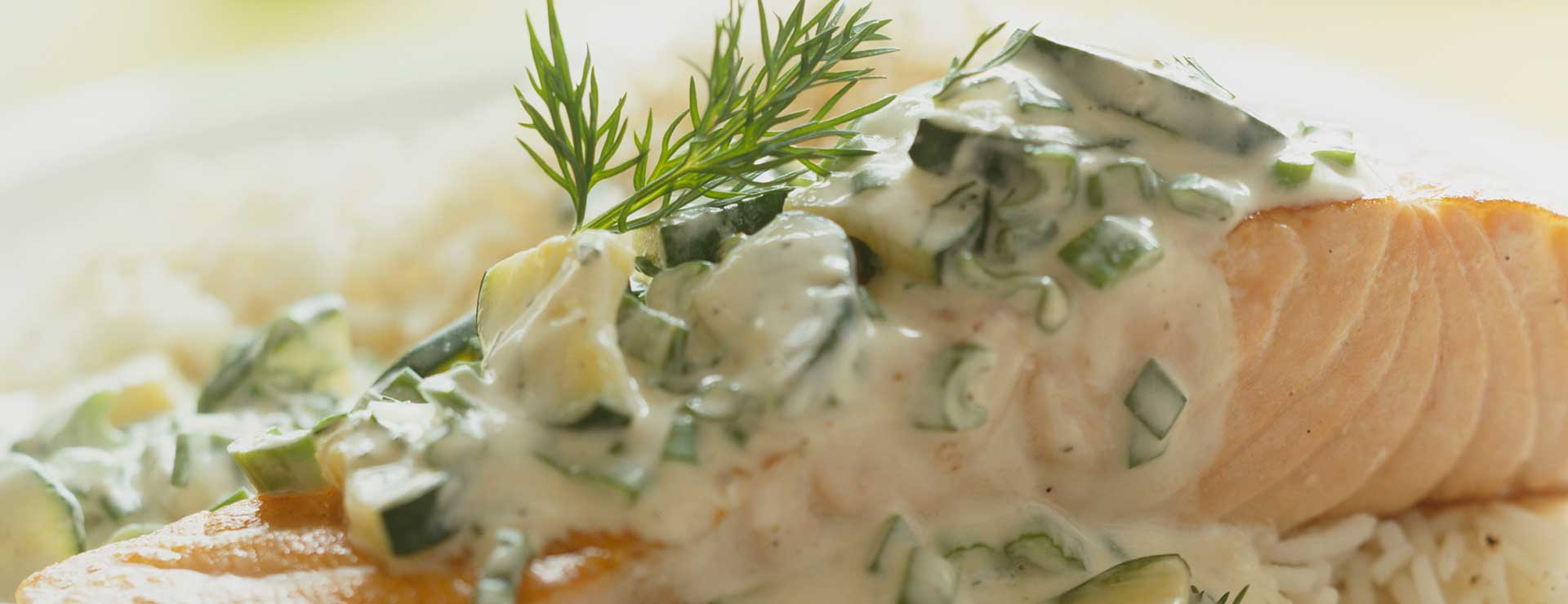 salmon with dill sauce on plate