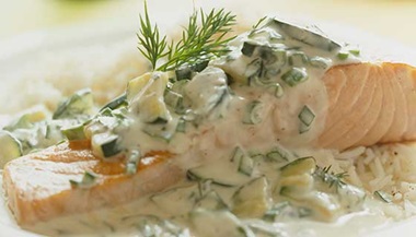 salmon with dill sauce on plate