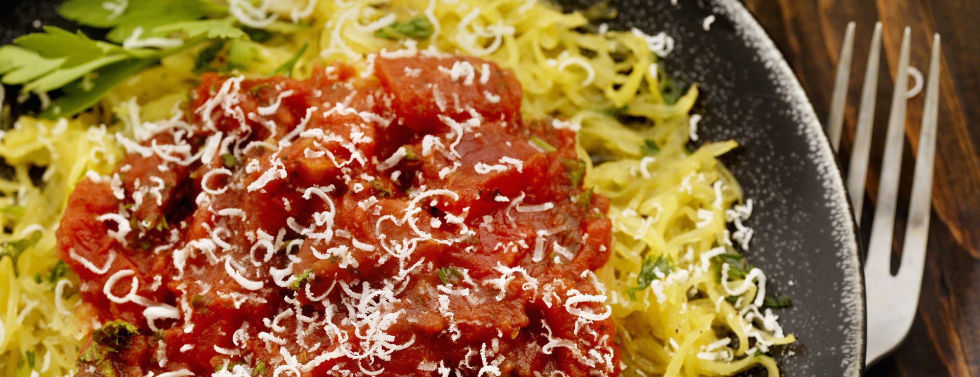 Plate of spaghetti squash with a healthy sauce and turkey meatballs