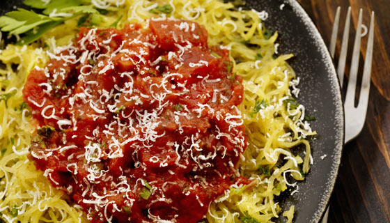 Plate of spaghetti squash with a healthy sauce and turkey meatballs