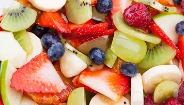 A close up of assorted cut fruits.