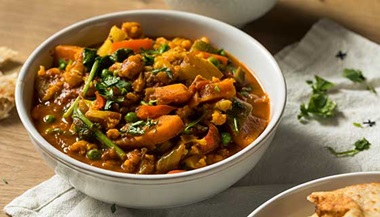 A bowl of vegetable curry.
