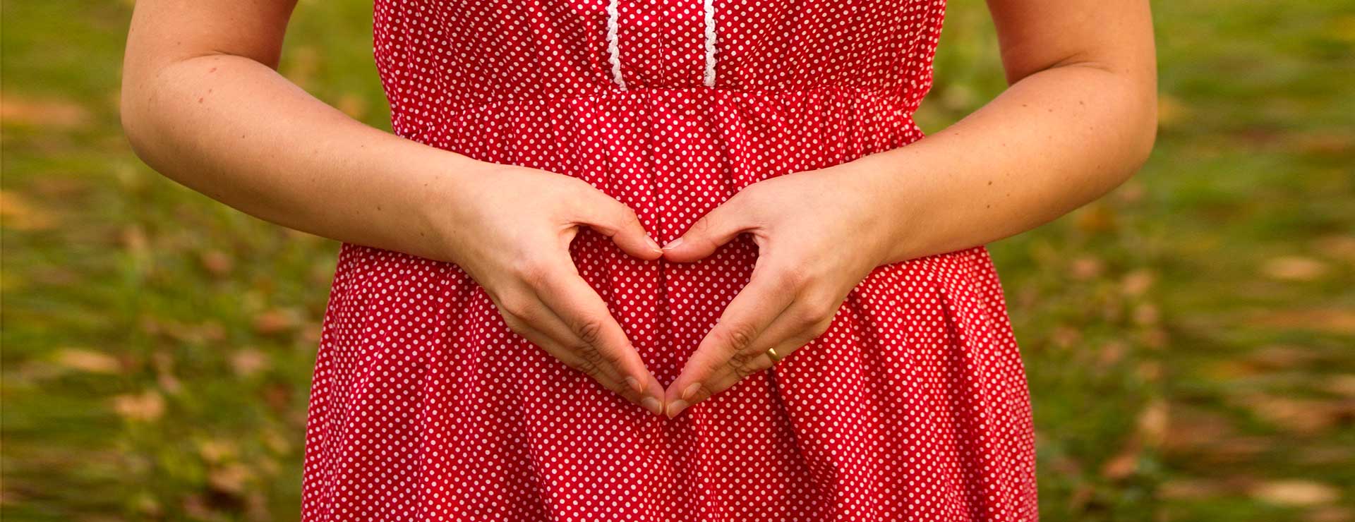 Woman making a heart shape with her hands