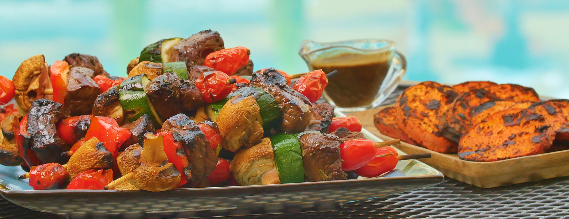 plate of balsamic steak skewers with mixed vegetables