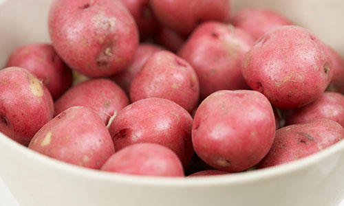 a bowl of red potatoes