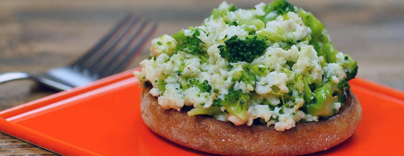 broccoli cheese egg scramble on an English muffin