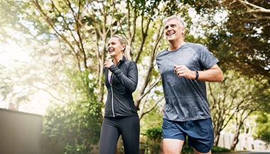 exercise and heart health - mature couple jogging