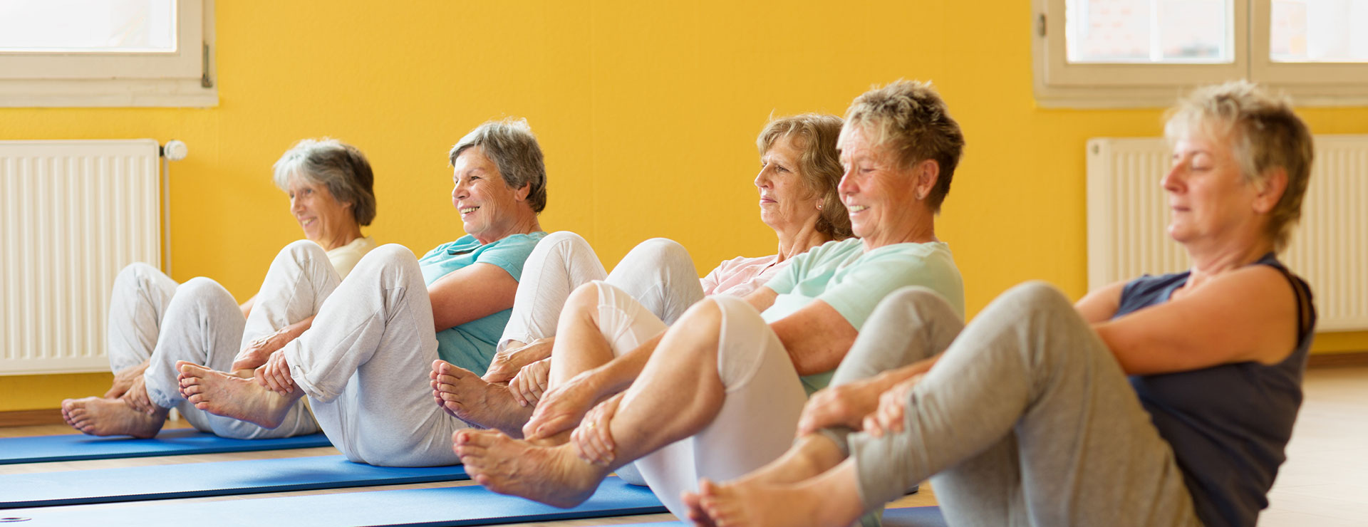 women doing yoga in a group