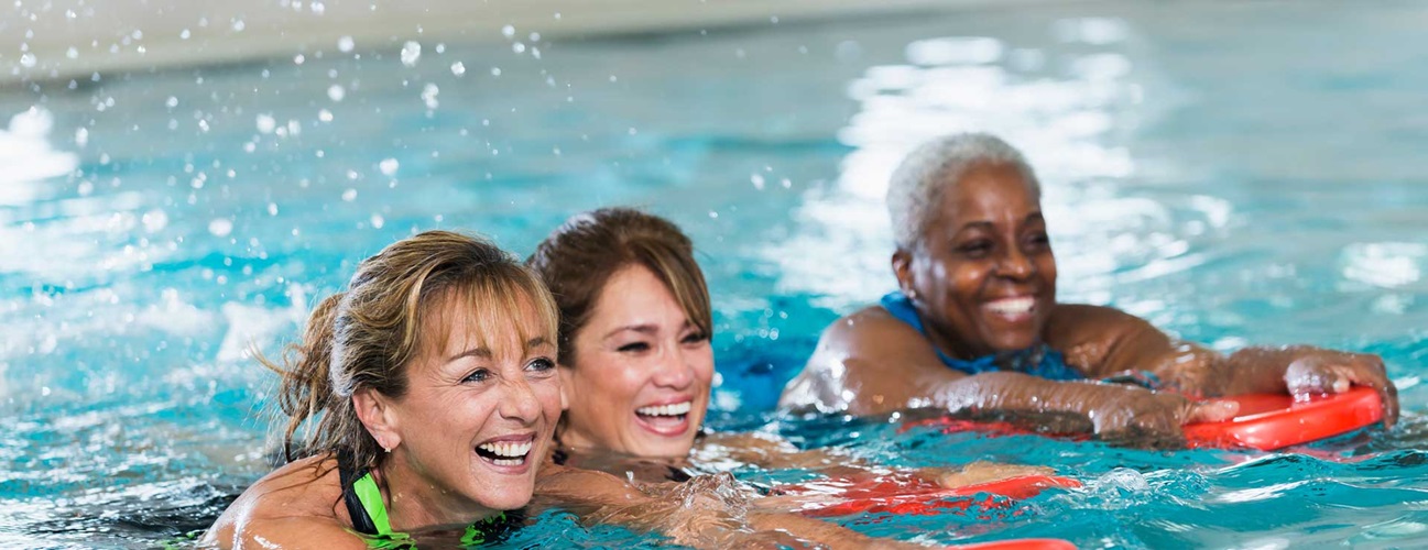 A group of women exercising in the pool