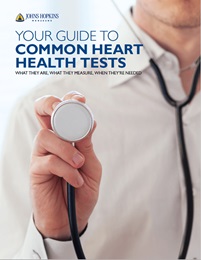 The cover of the downloadable guide to common heart health tests, which shows a doctor holding a stethoscope.
