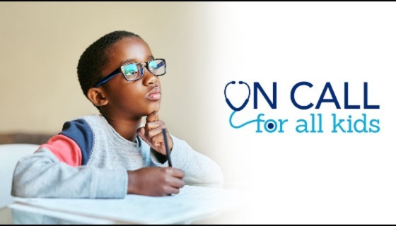 Young child studying at desk. 