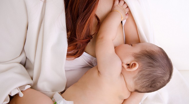 Asian baby breastfeeding