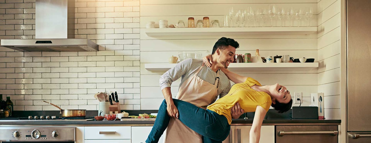 A couple dancing in the kitchen