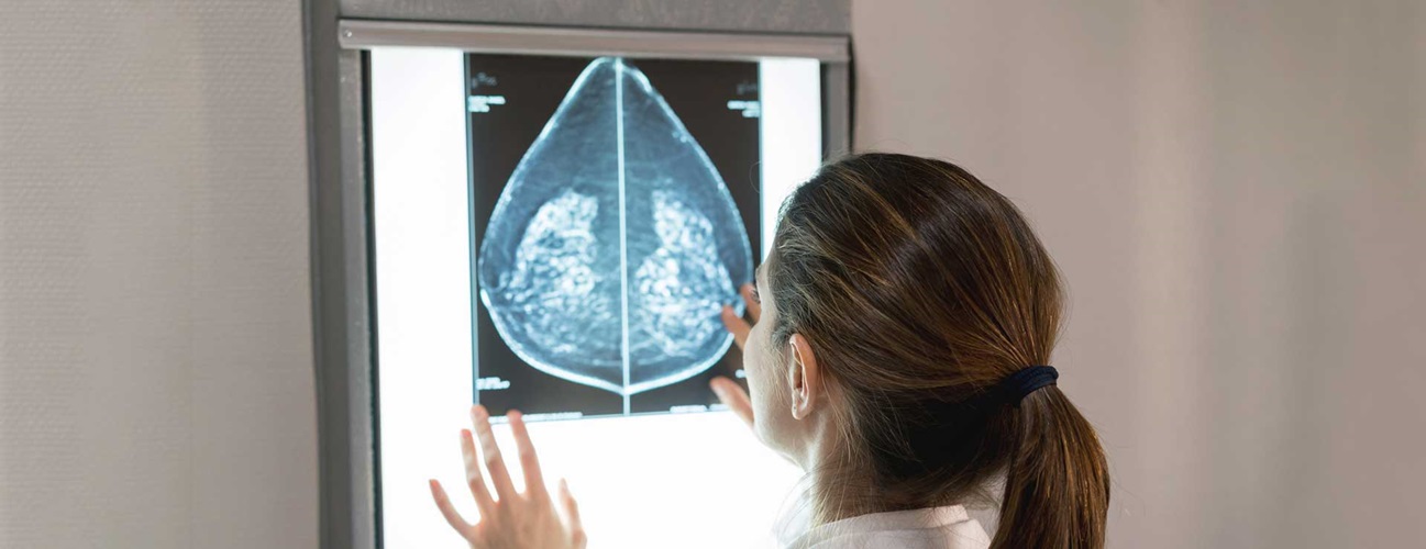 female gynocologist looking at a mammogram at the hospital 
