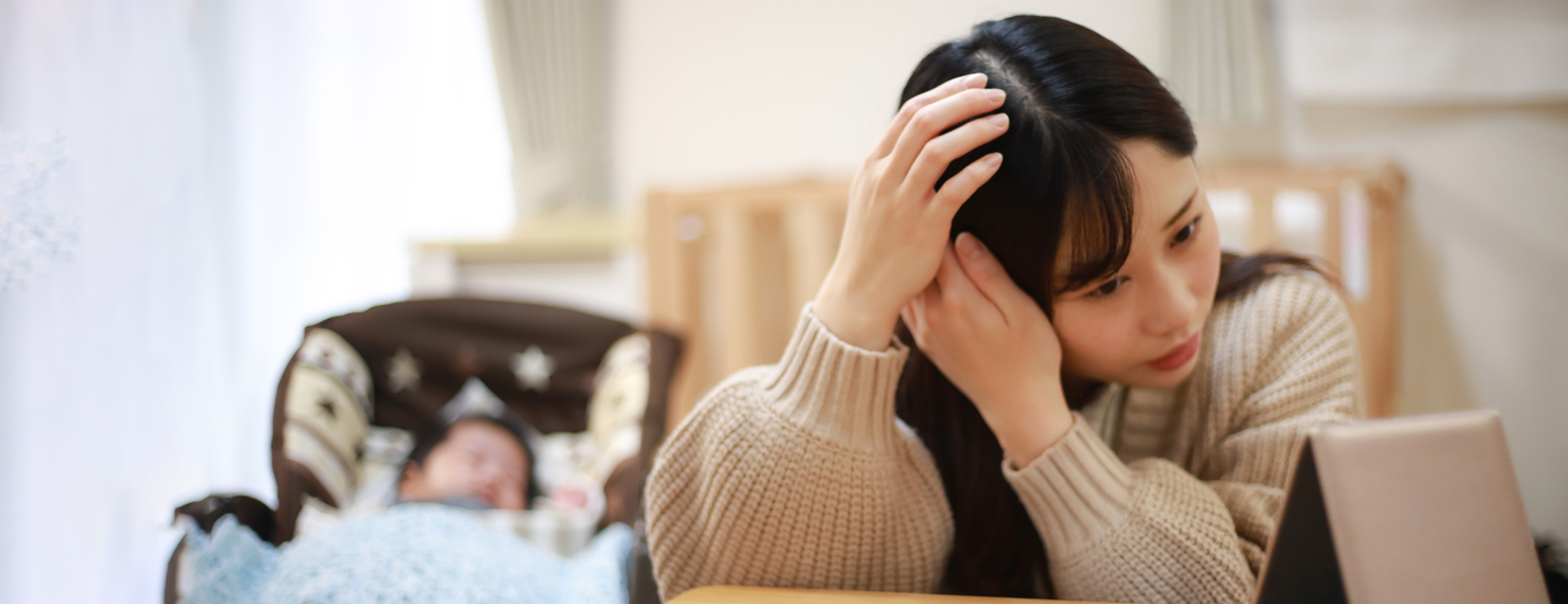A new mother looking at her hair