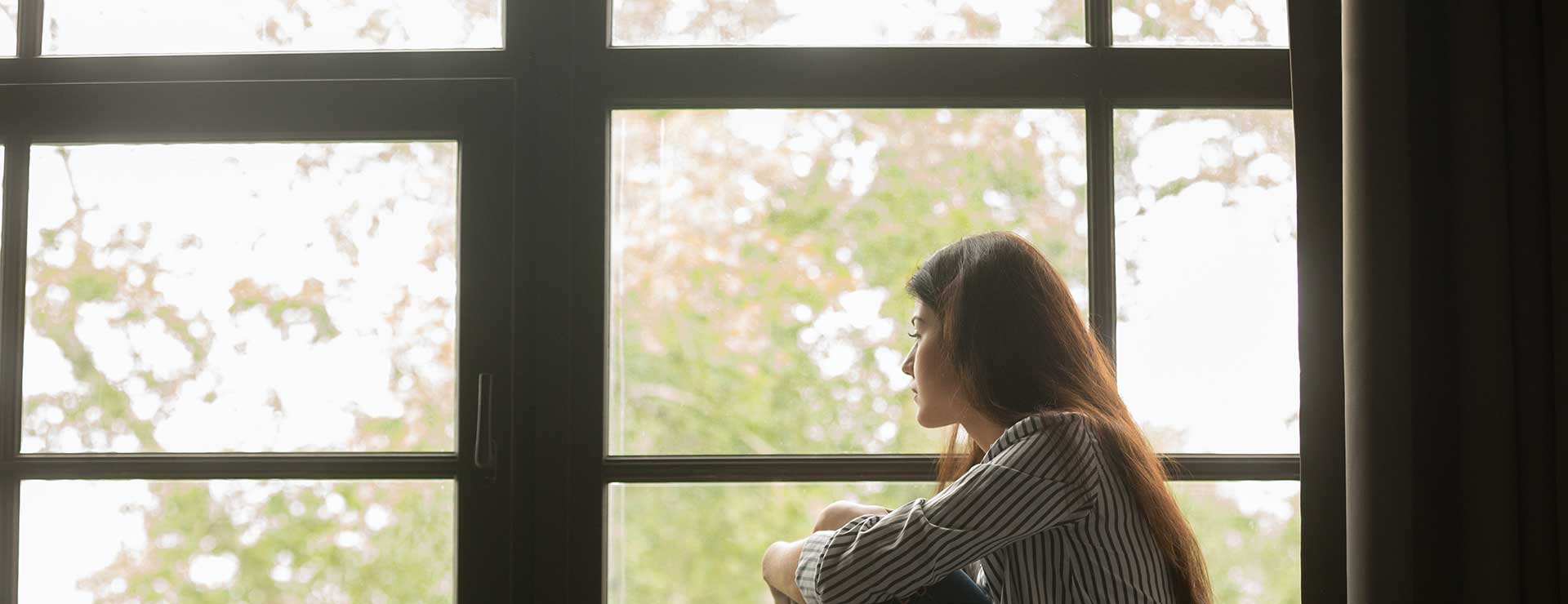 woman sitting by window