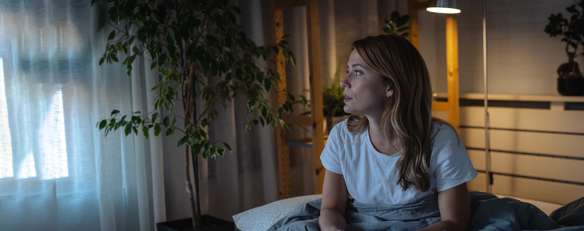 A woman sitting in bed