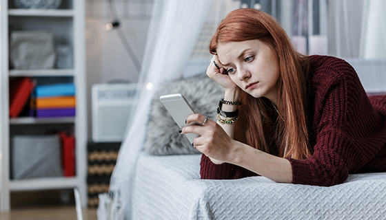 depressed woman on phone