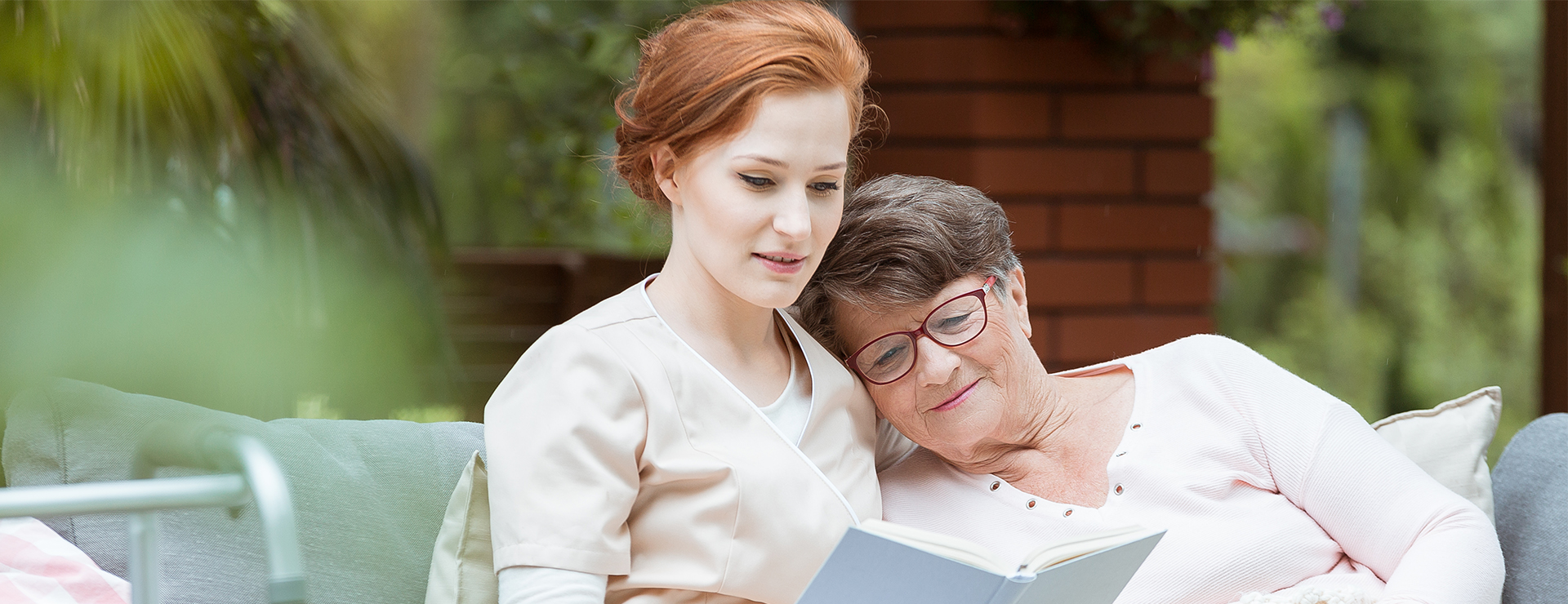 woman reading with caregiver