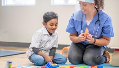 Occupational therapist with pediatric patient