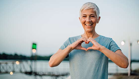 Woman making a heart shape with her hands