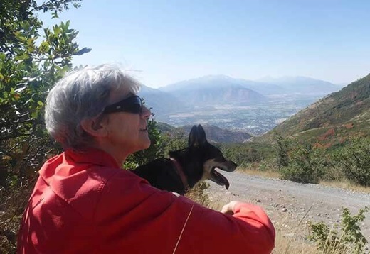 Jane enjoying a hike with her dog, post-surgery.