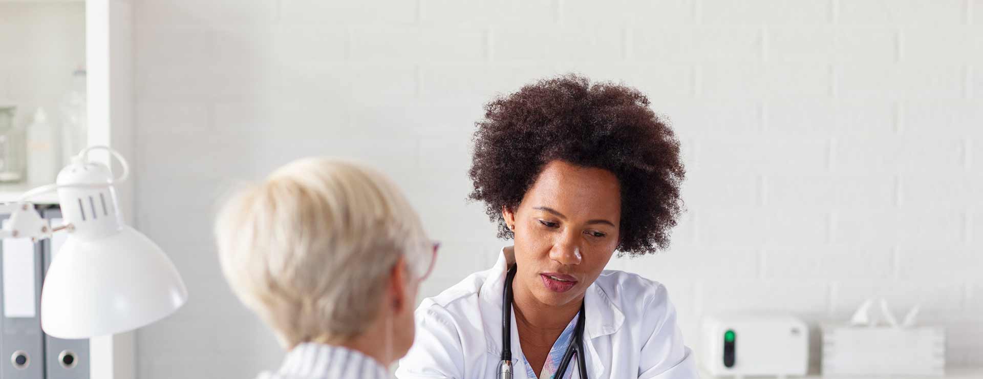 Doctor consulting patient. 
