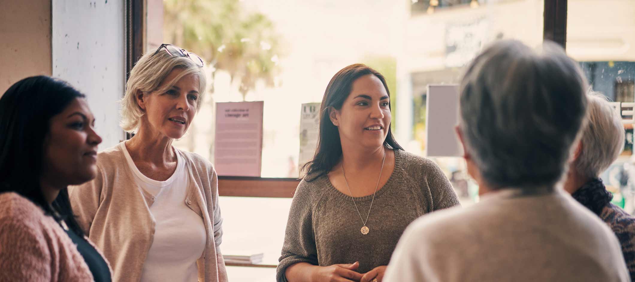 Women standing and talking.