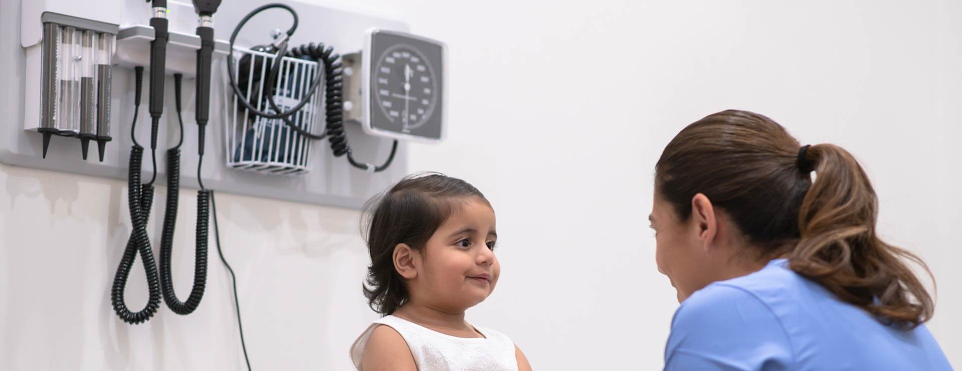 Child with a doctor in a clinical setting