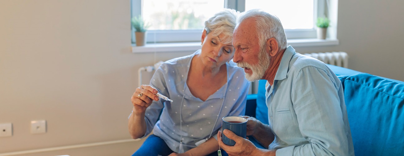 Man and woman read the thermometer with concern