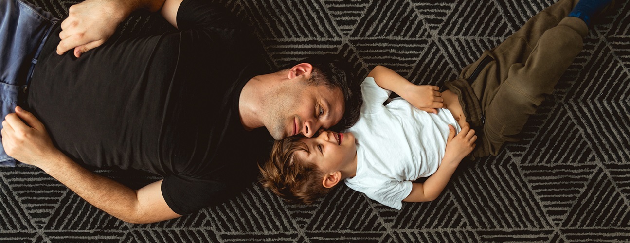 father and son on carpet