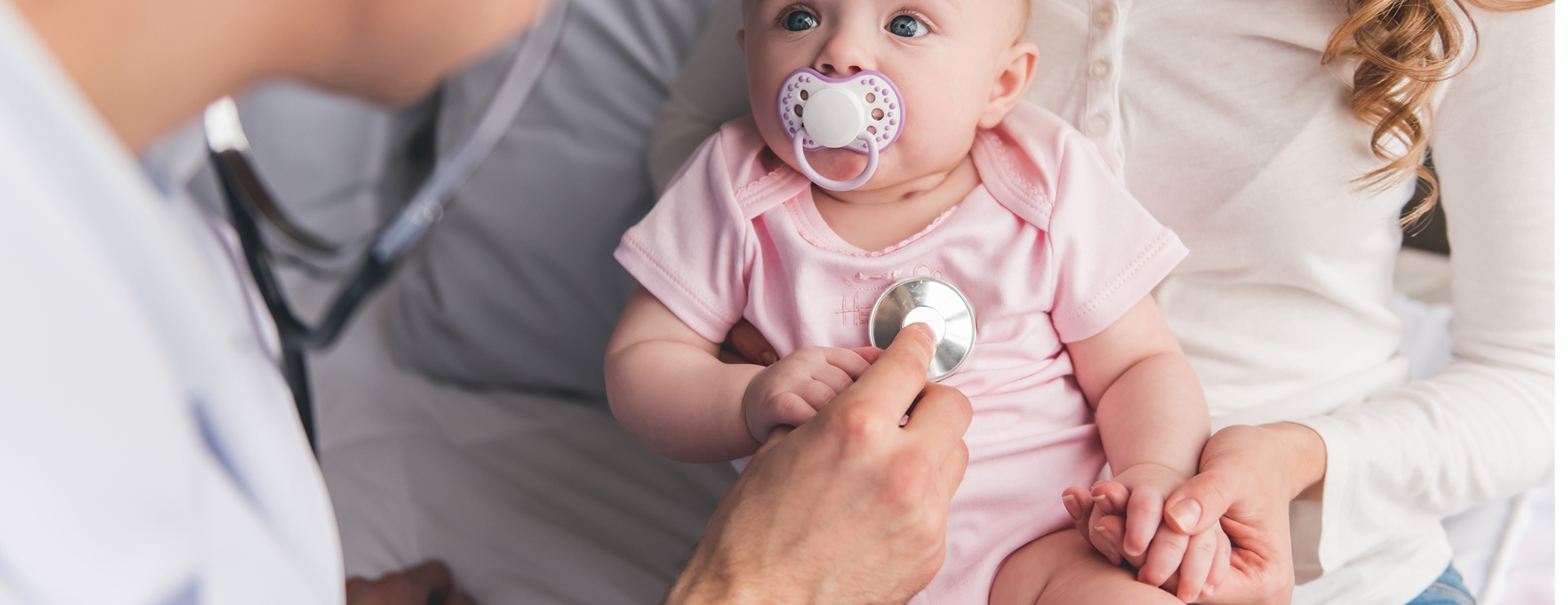 doctor listening to baby's heart