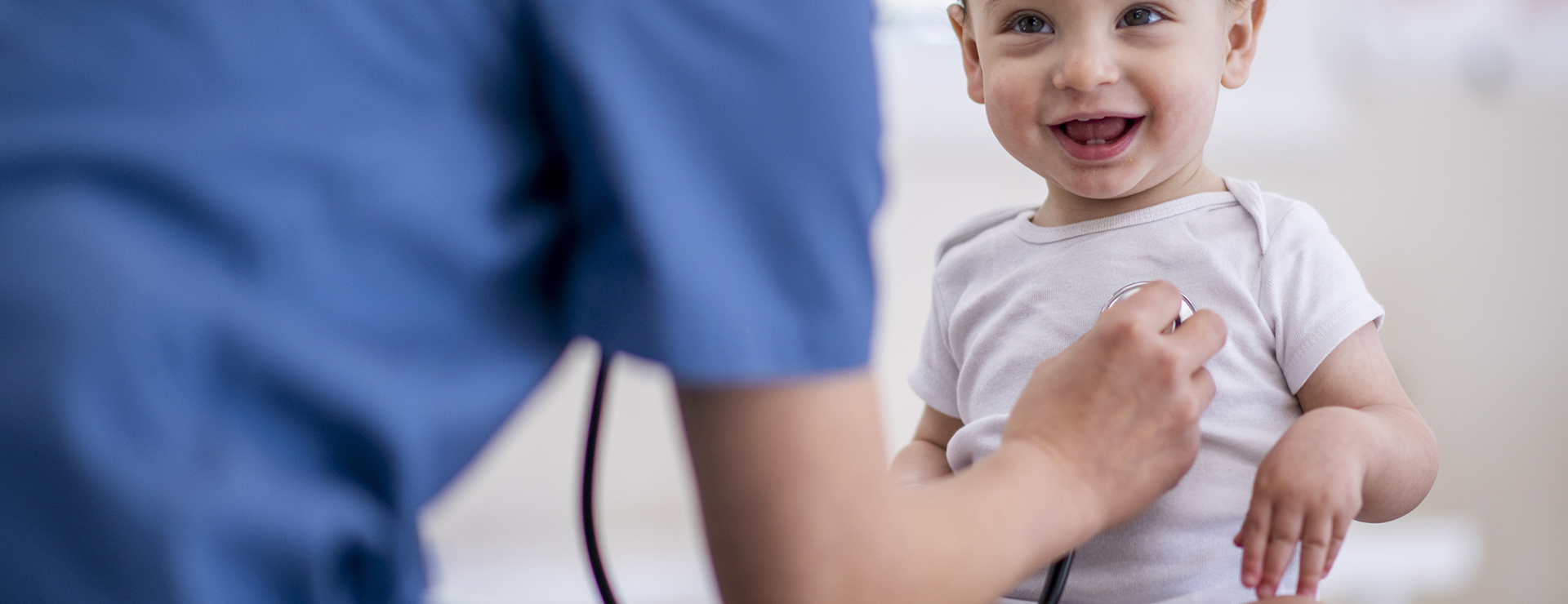 nurse listening to baby's chest