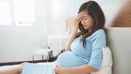 pregnant woman with a headache