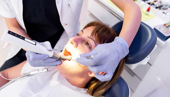Women receiving a dental treatment. 