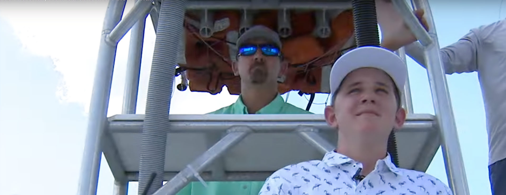 Photo of Caleb on a boat