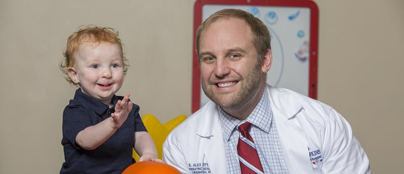 Dr and child smiling for a photo