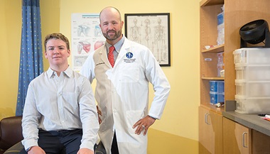 Christopher with expert in orthopaedics, Drew Warnick, M.D., of John Hopkins All Children's Hospital. 