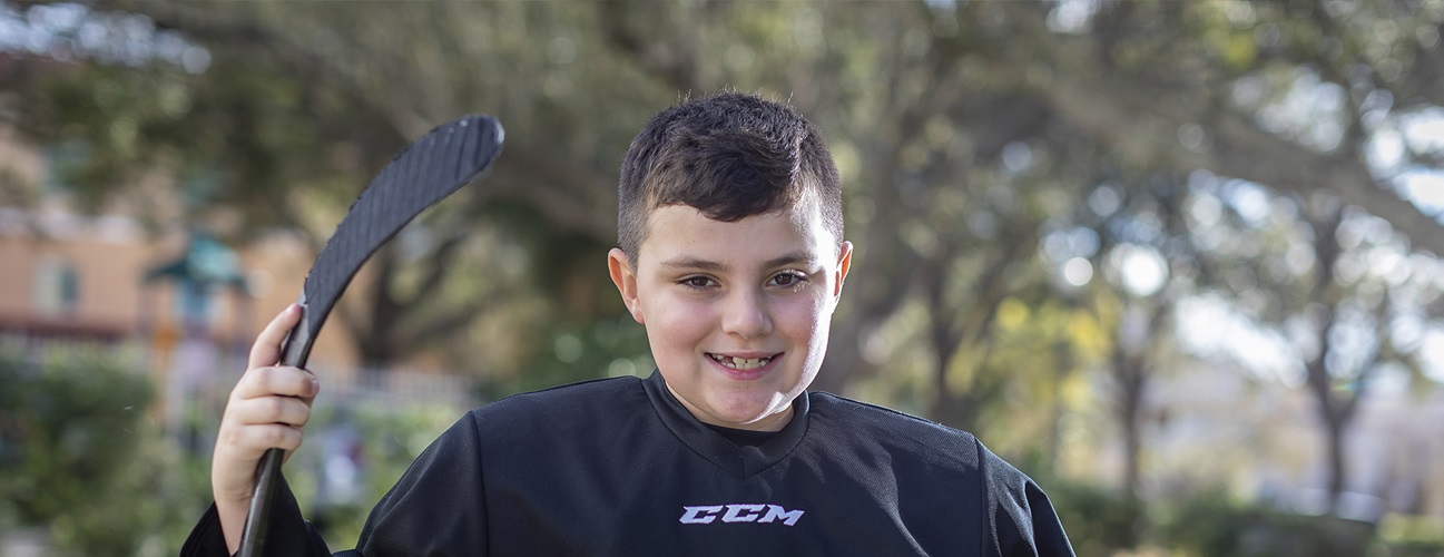 Evan, 8, loves to play hockey.