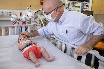 Baby Cristian with Dr. David Kays at Johns Hopkins All Children's Hospital.