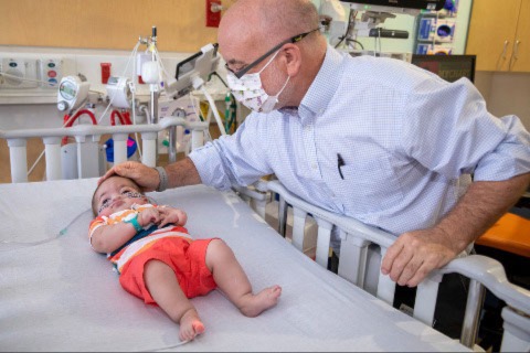 Baby Cristian with Dr. David Kays at Johns Hopkins All Children's Hospital.