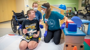 Ethan at a physical therapy session at Johns Hopkins All Children's Hospital.
