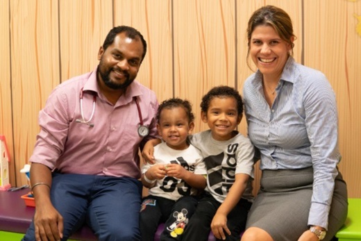 Doctor Deepak Chellapandian, M.D., and Doctor  Jennifer Leiding, M.D., with brothers Evian and Jerrick at All Children’s Hospital