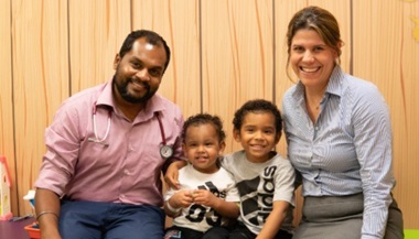 Doctor Deepak Chellapandian, M.D., and Doctor  Jennifer Leiding, M.D., with brothers Evian and Jerrick at All Children’s Hospital