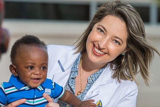 Baby Jauhe'y with Joan Machry, M.D. outside of Johns Hopkins All Children's Hospital. 